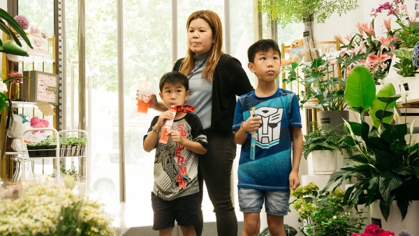 Mom and sons in plant shop