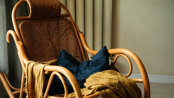 Rocking chair with pillow and blanket